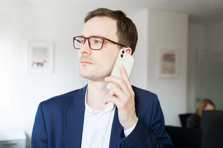 Consultant taking a call in the office